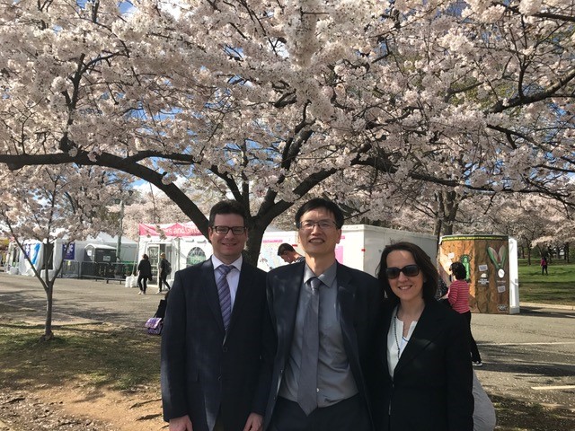 Dr. Shaun Clarke (U. Michigan), Dr. Michael Cai (DNN R&D), and Prof. Sara Pozzi (U Michigan) under a cherry blossom tree