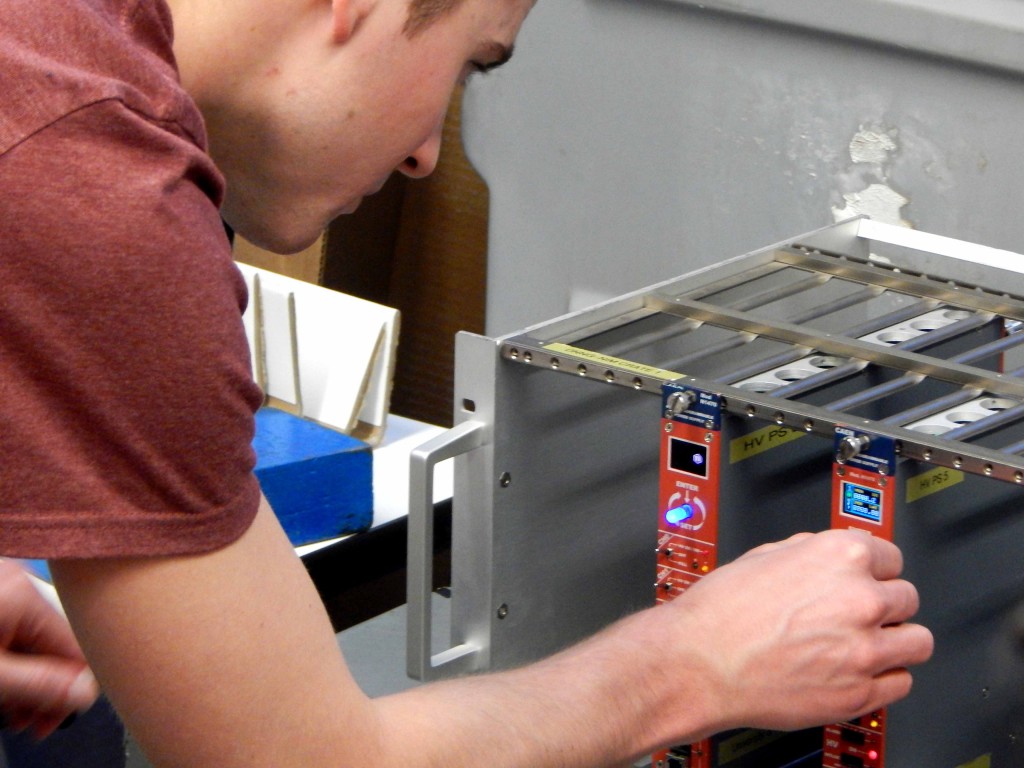 An undergraduate student attempts to calibrate a detector.