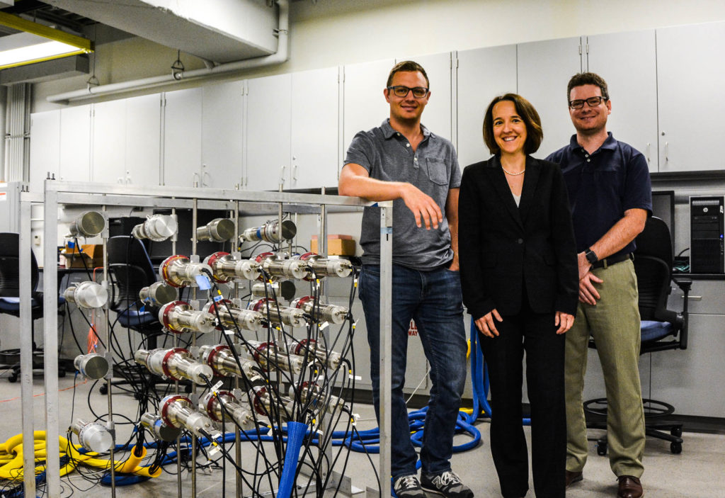 Dr. Michael Hamel, Prof. Sara Pozzi, and Dr. Shaun Clarke are photographed with the Dual Particle Imaging system at the University of Michigan.