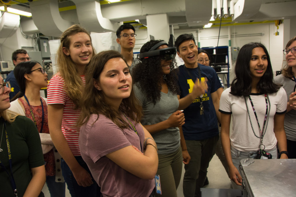 Tony Shin, CVT Fellow, gives a lab tour to an enthusiastic group of high-school students. 